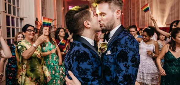 Ben Cohen and husband Anthony James share a kiss at their wedding