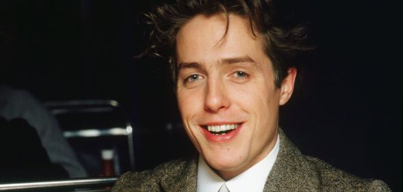 Close-up of British actor Hugh Grant (in costume as Clive Durham) during the filming of 'Maurice' (directed by James Ivory), London, England, December 1986.
