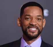 Will Smith smiling in a lilac shirt and black jacket