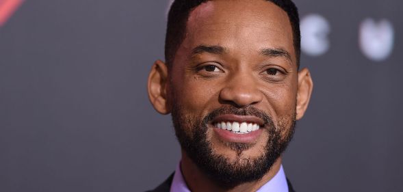 Will Smith smiling in a lilac shirt and black jacket