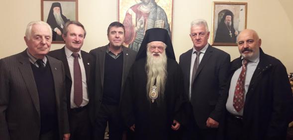 Bishop Amvrosios of Kalavryta (C) poses with followers.