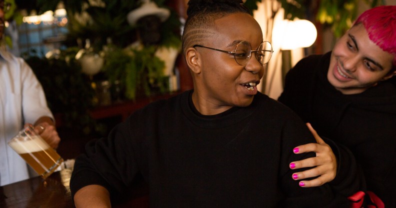 A transmasculine person with a friend at the bar. (The Gender Spectrum Collection/Broadly)