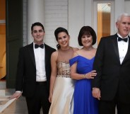 Vice President Mike Pence (C), his wife Karen Pence, their daughters Audrey (2nd L) and Charlotte (2nd R) and their son Michael and his wife Sarah pose for photographs on the front porch of the vice presidential residence at the U.S Naval Observatory before heading to the inaugural balls January 20, 2017 in Washington, DC.