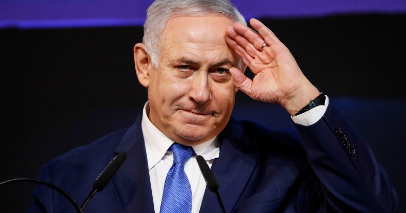 Benjamin Netanyahu saluting