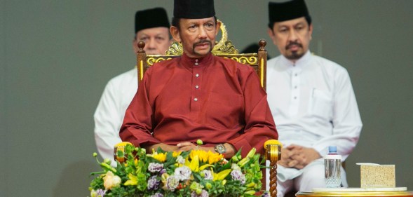 Brunei's Sultan Hassanal Bolkiah (C) attends an event in Bandar Seri Begawan on April 3, 2019.