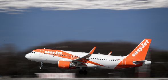An EasyJet Airbus A320 commercial plane with registration HB-JXF is landing at Geneva Airport on March 22, 2019 in Geneva.
