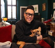 Gay TV presenter Gok Wan at home with his dog