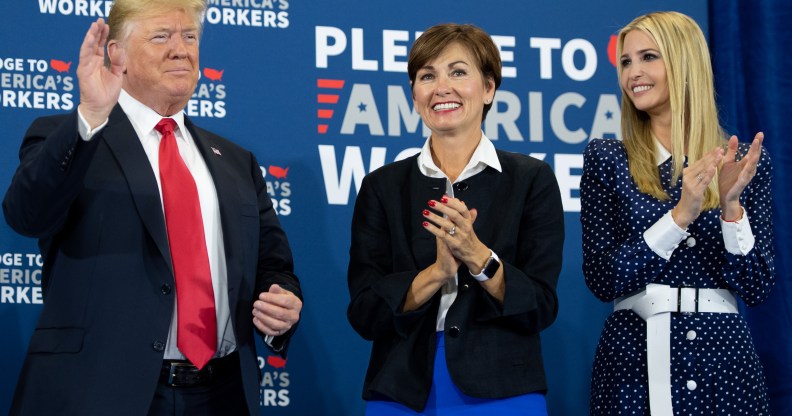 Iowa Governor Kim Reynolds (C) pictured between President Donald Trump (L) and his daughter Ivanka Trump (R), as he holds a roundtable discussion on workforce development at Northeast Iowa Community College in Peosta, Iowa, July 26, 2018.