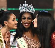 Jazell Barbie Royale (C) of the US, the Miss International Queen 2019 receives a kiss from finalists Kanwara Kaewjin (L) of Thailand and Yaya (R) of China