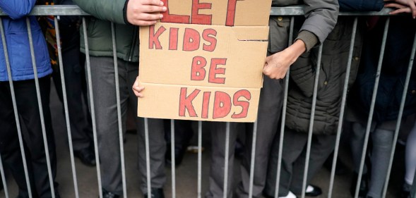 Parents and protestors demonstrate against the 'No Outsiders' programme, which teaches children about LGBT rights in Birmingham, England