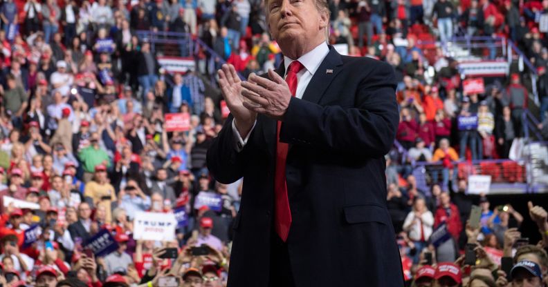 US President Donald Trump claps as he leaves after speaking during a Make America Great Again rally in Green Bay, Wisconsin, April 27, 2019
