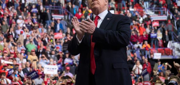US President Donald Trump claps as he leaves after speaking during a Make America Great Again rally in Green Bay, Wisconsin, April 27, 2019