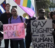 A group of people from the gay, lesbian and transgender community in South Africa demonstrate outside the Parliament in Cape Town, on May 19, 2012. The protesters gathered to oppose the proposal by the House of Traditional Leaders to remove the term "sexual orientation" from section 9 (3) of the South African Constitution, which prohibits unfair discrimination. AFP PHOTO / RODGER BOSCH (Photo credit should read RODGER BOSCH/AFP/GettyImages)