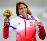 Poland's Zofia Klepacka celebrates her bronze medal on the podium.