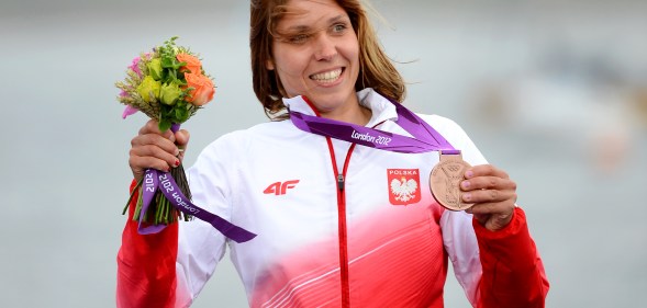 Poland's Zofia Klepacka celebrates her bronze medal on the podium.