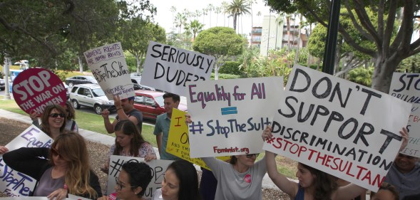 Demonstrators protest the punishment of women and LGBT people announced by the Sultan of Brunei near the Beverly Hills Hotel, which is owned by the Sultan, in Beverly Hills, California
