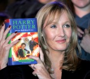 JK Rowling holds Harry Potter book