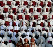 Vatican bishops and cardinals who, according to a new book, are for the most part gay, attend mass.