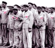 Gay men wearing pink triangle, representing Holocaust Memorial Day
