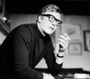 English actor Michael Caine smoking a cigarette.