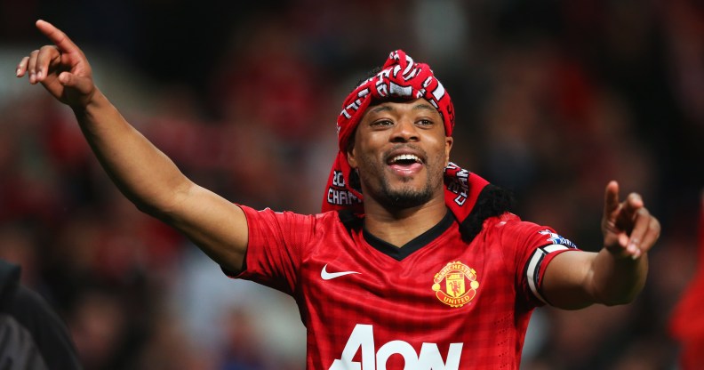 Patrice Evra of Manchester United celebrates victory and winning the Premier League title after the Barclays Premier League match between Manchester United and Aston Villa at Old Trafford on April 22, 2013 in Manchester, England.