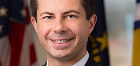 Pete Buttigieg holding a microphone