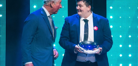 Prince Charles, Prince of Wales with winner of the Educational Award, Jay Kelly during the annual Prince's Trust Awards at the London Palladium on March 13, 2019 in London, England.