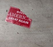 A 'Make America Great Again; sign sits on the floor following a Republicans rally on October 24, 2018.