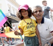 Mayor of London Sadiq Khan with a young flag bearer during the Pride In London parade on July 7, 2018 in London, England.