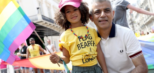 Mayor of London Sadiq Khan with a young flag bearer during the Pride In London parade on July 7, 2018 in London, England.