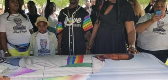 Nigel Shelby buried in rainbow casket.