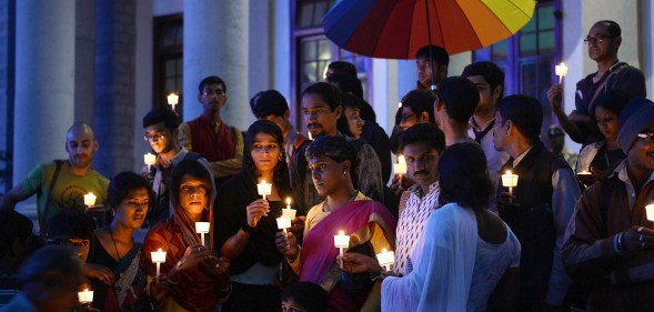 Transgender activists and their supporters take part in a candle light vigil.