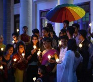 Transgender activists and their supporters take part in a candle light vigil.