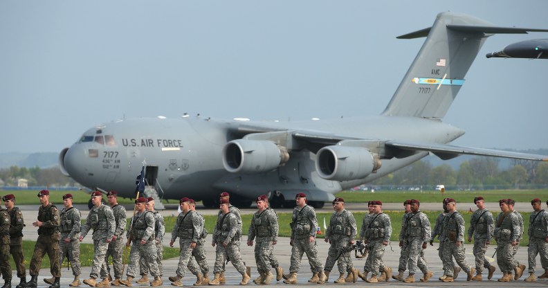 Members of the U.S. Army 173rd Airborne Brigade disembark upon their arrival by plane at a Polish air force base on April 23, 2014 in Swidwin, Poland.