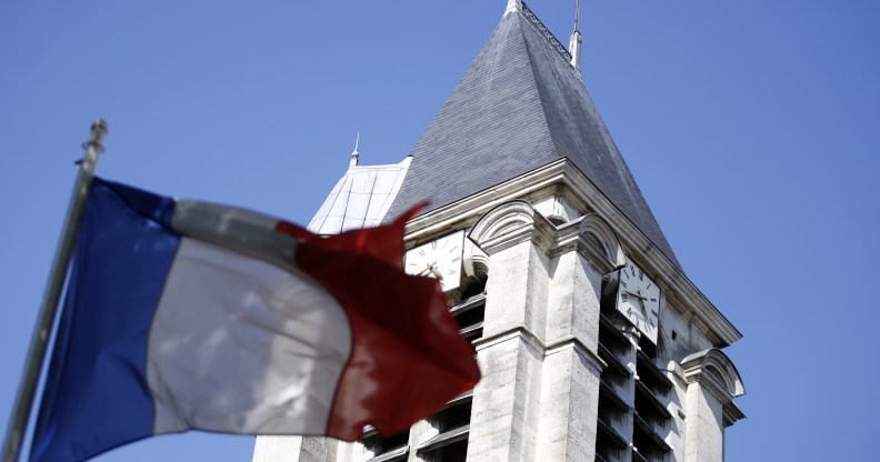 A French flag flying outside of a church