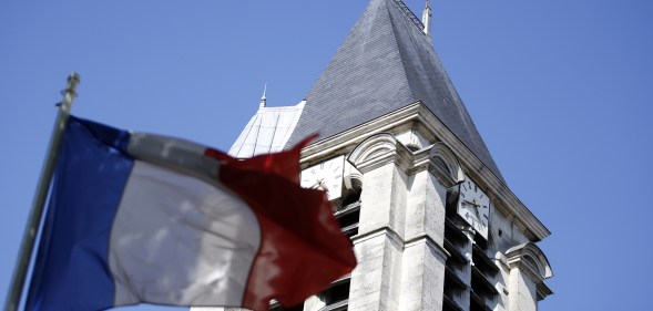 A French flag flying outside of a church