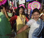 Hijras dance in the street