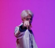 BTS rapper RM, real name Kim Namjoon, performs "Persona" in front of bisexual flag colours.