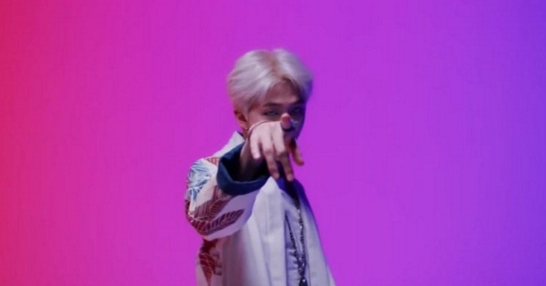 BTS rapper RM, real name Kim Namjoon, performs "Persona" in front of bisexual flag colours.