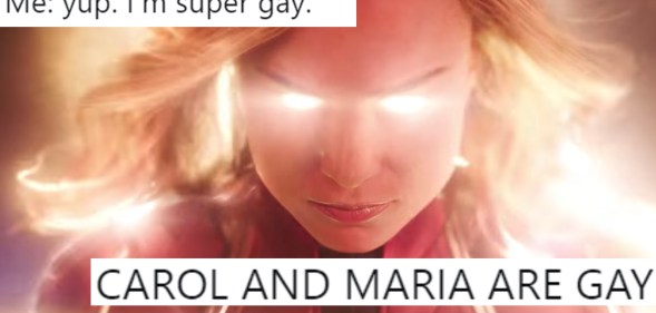 A shot from Captain Marvel overlaid with tweets about its queer subtext.