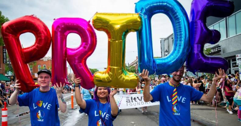 People holding Pride balloons at Edmonton Pride