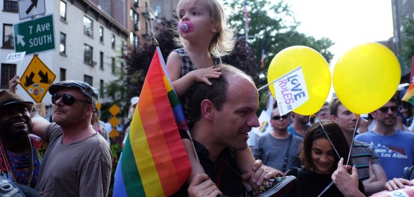 A dad and child, representing two thirds of gay dads saying they face stigma in a new survey