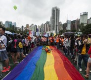 People in Hong Kong take part in the LGBT parade with other lesbian, gay, bisexual and trans people in 2014