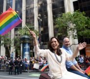Kamala Harris waves a rainbow flag while participating in the San Francisco Pride parade in San Francisco, California on Sunday, June, 26 2016