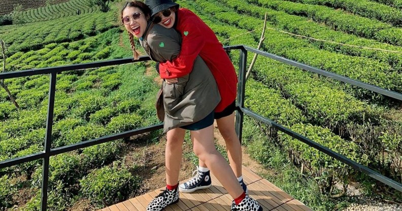 Former The Bachelor contestants Minh Thu and Truc Nhu embracing.