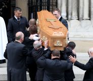 Pallbearers carry the coffin of journalist Lyra McKee