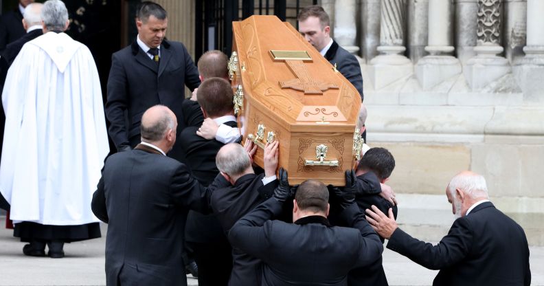 Pallbearers carry the coffin of journalist Lyra McKee
