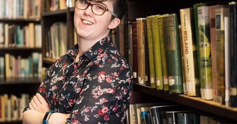 Lyra McKee posing in a library