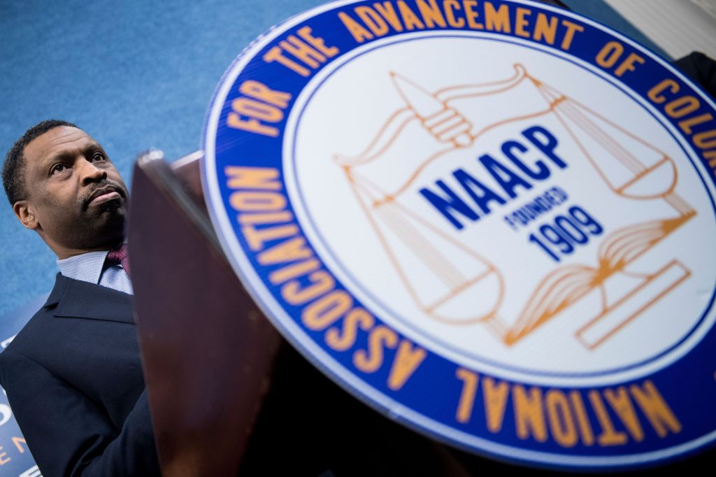 Derrick Johnson, President and CEO of the NAACP, pauses while speaking during a press conference announcing a lawsuit by the NAACP