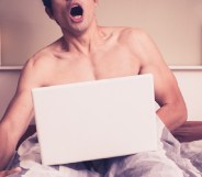 Man watchin porn on laptop